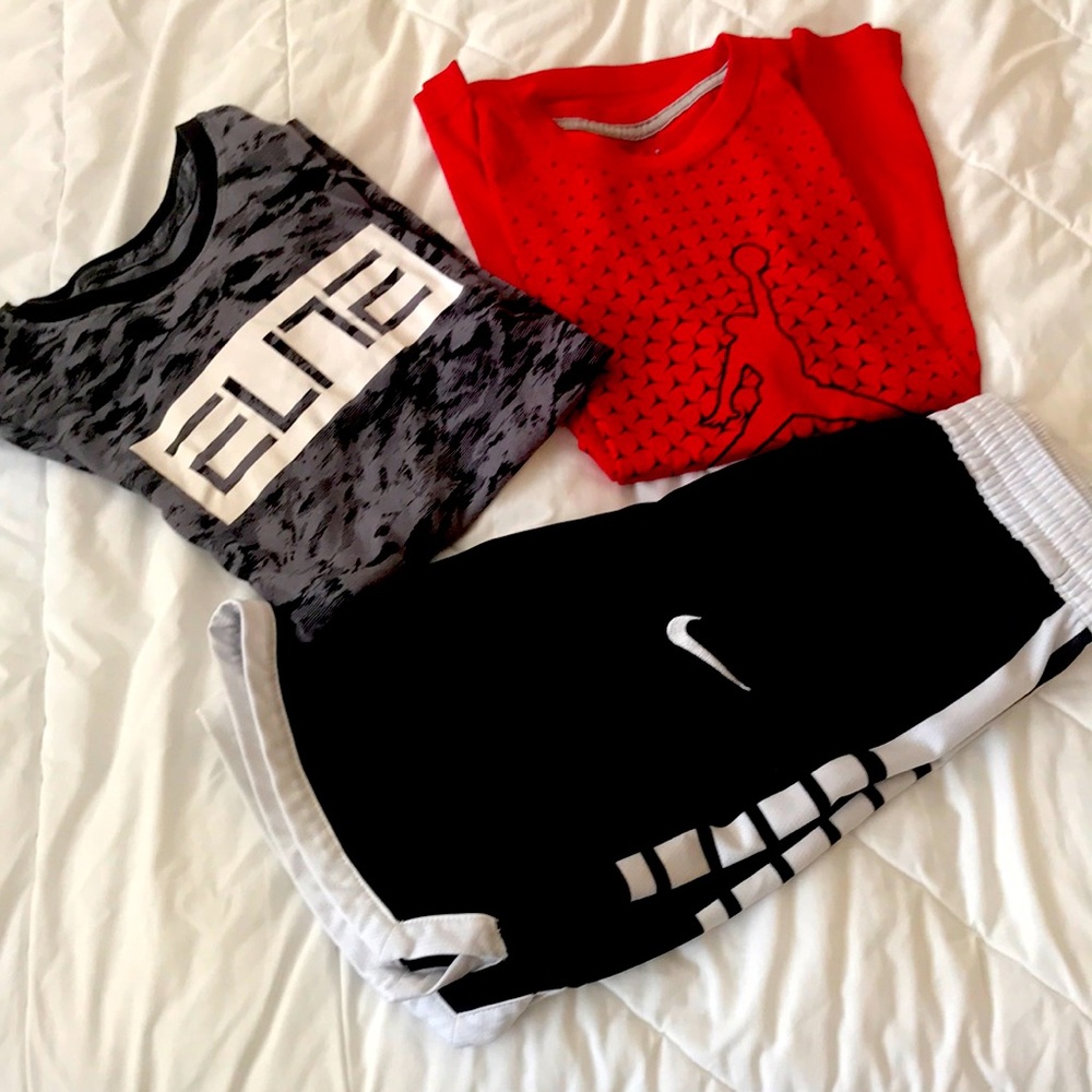 2 Nike basketball shirts and 1 pair shorts